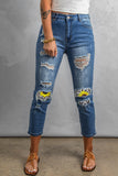 Jeans crop con fori consumati sbiaditi