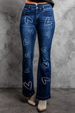 Jeans svasati a vita alta con stampa margherita