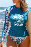 Costumi da bagno da surf con maniche raglan patchwork stampa tropicale blu