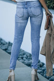 Jeans skinny consumati a vita alta