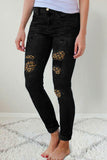 Jeans skinny a vita alta con tasca con toppe leopardate strappate