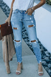 Jeans skinny consumati a vita alta