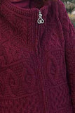 Giacca maglione lavorata a maglia con trecce aperte sul davanti da donna