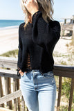 Maglione in maglia nera effetto consumato da donna