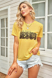 T-shirt grafica gialla con stampa lettere 